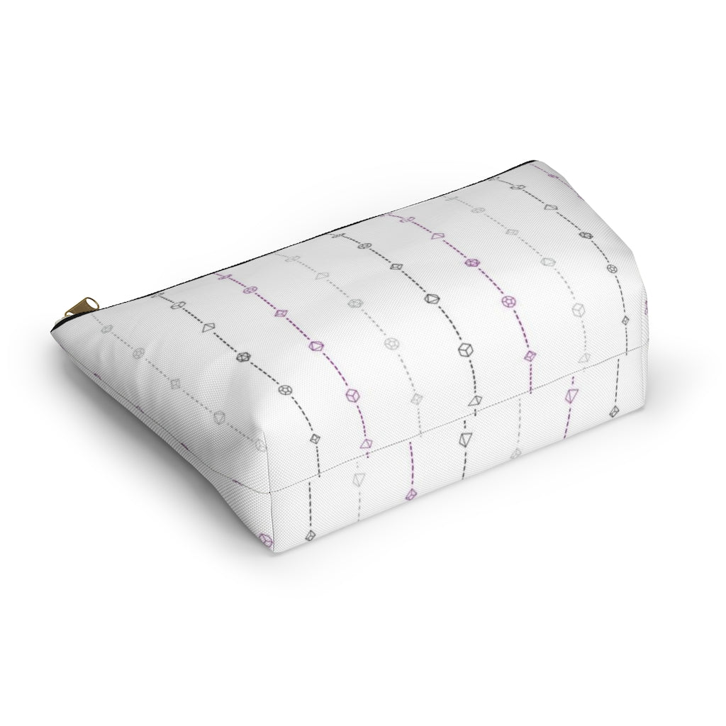 the large asexual dice t-bottom pouch in bottom view on a white background. it's white with black, grey, and purple stripes of dashed lines and polyhedral dice and a gold zipper pull
