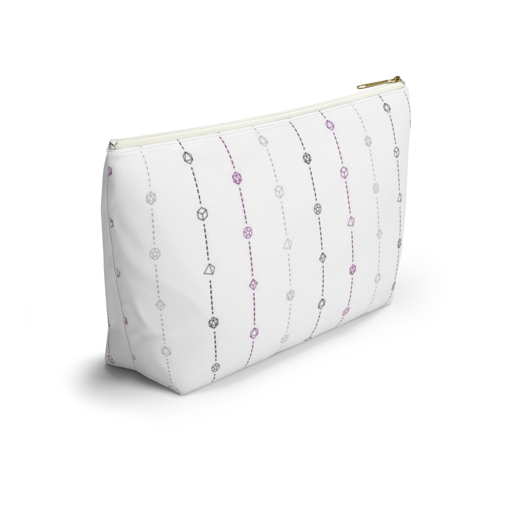 the large asexual dice t-bottom pouch in side view on a white background. it's white with black, grey, and purple stripes of dashed lines and polyhedral dice and a gold zipper pull