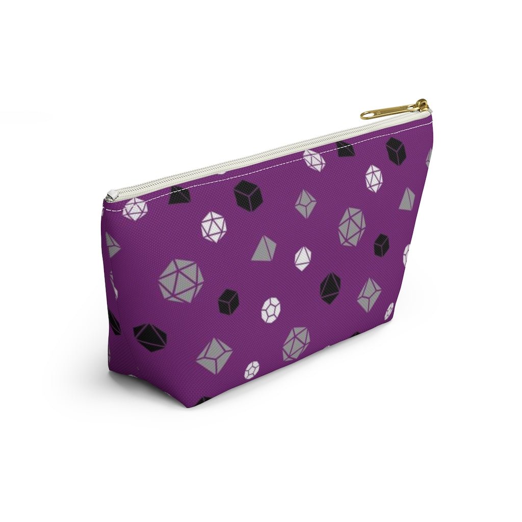 the small asexual dice t-bottom pouch in side view on a white background. it's purple with grey, black, and white polyhedral dice and a gold zipper pull