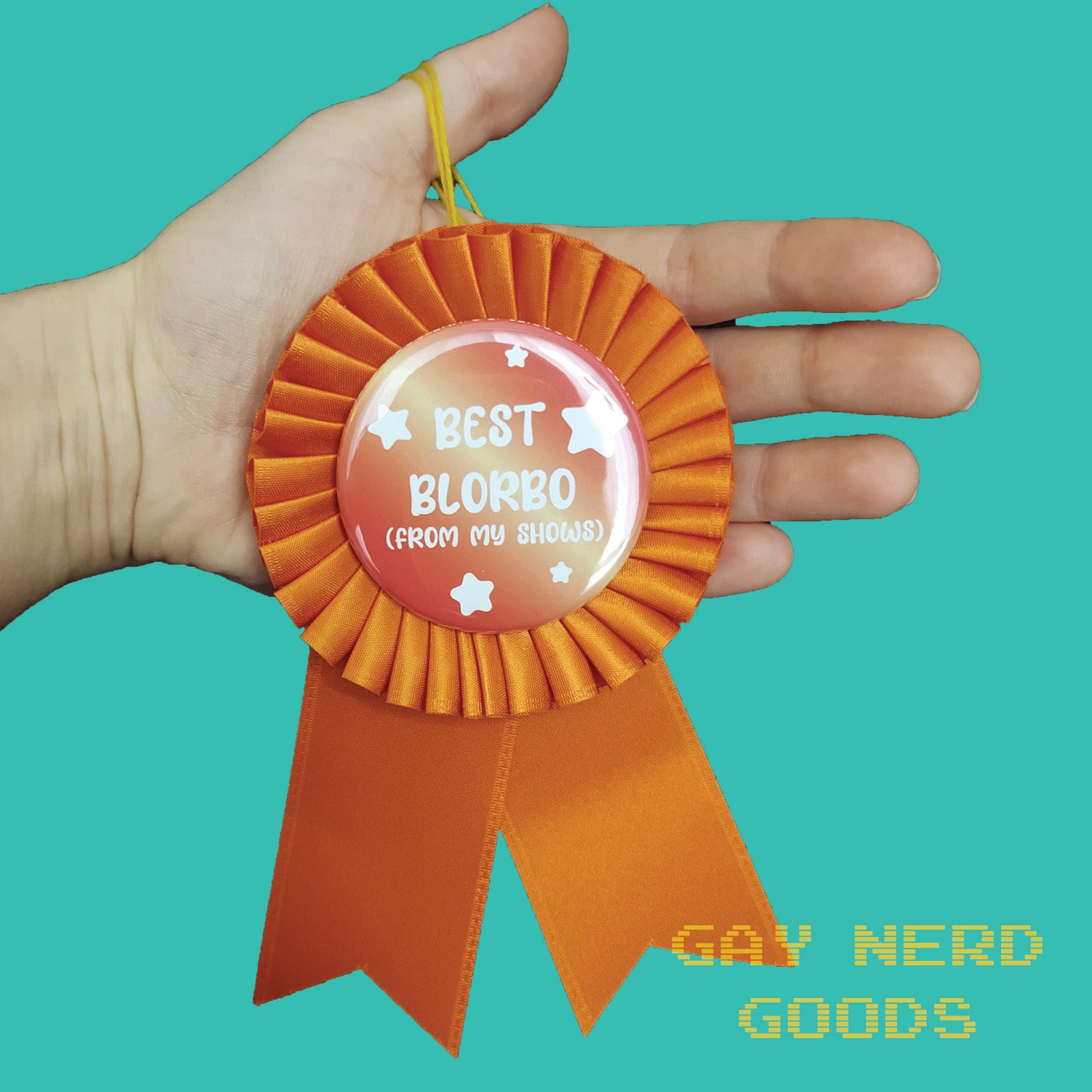 best blorbo orange satin award ribbon held in a hand on a mint green background