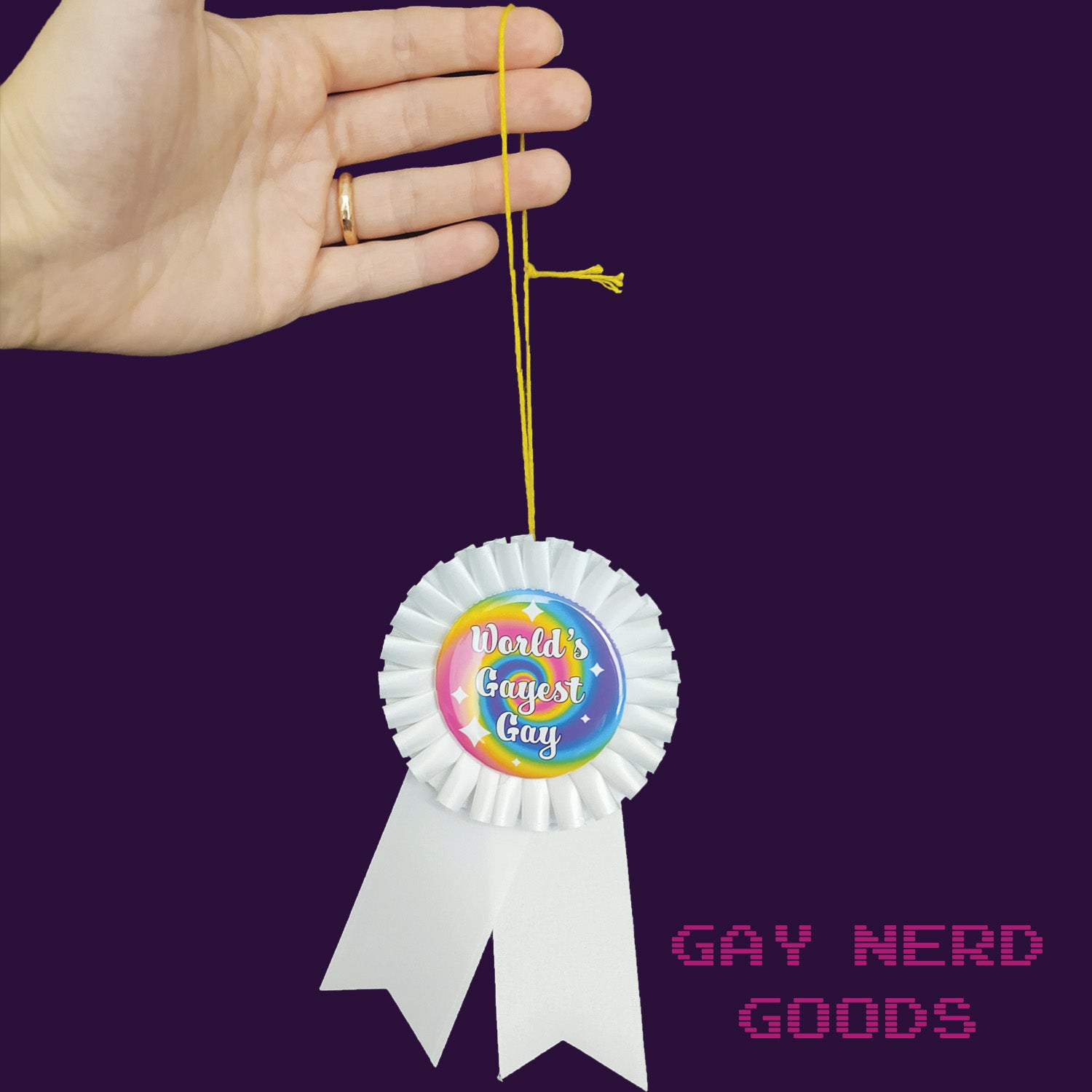 world's gayest gay award being held by a thread loop held by a hand