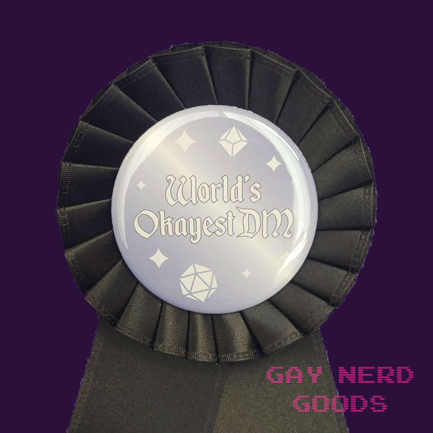 close up view of the "world's okayest DM" award ribbon. The text is white surrounded by white polyhedral dice and sparkles on a grey and white gradient background. The satin ribbon is black