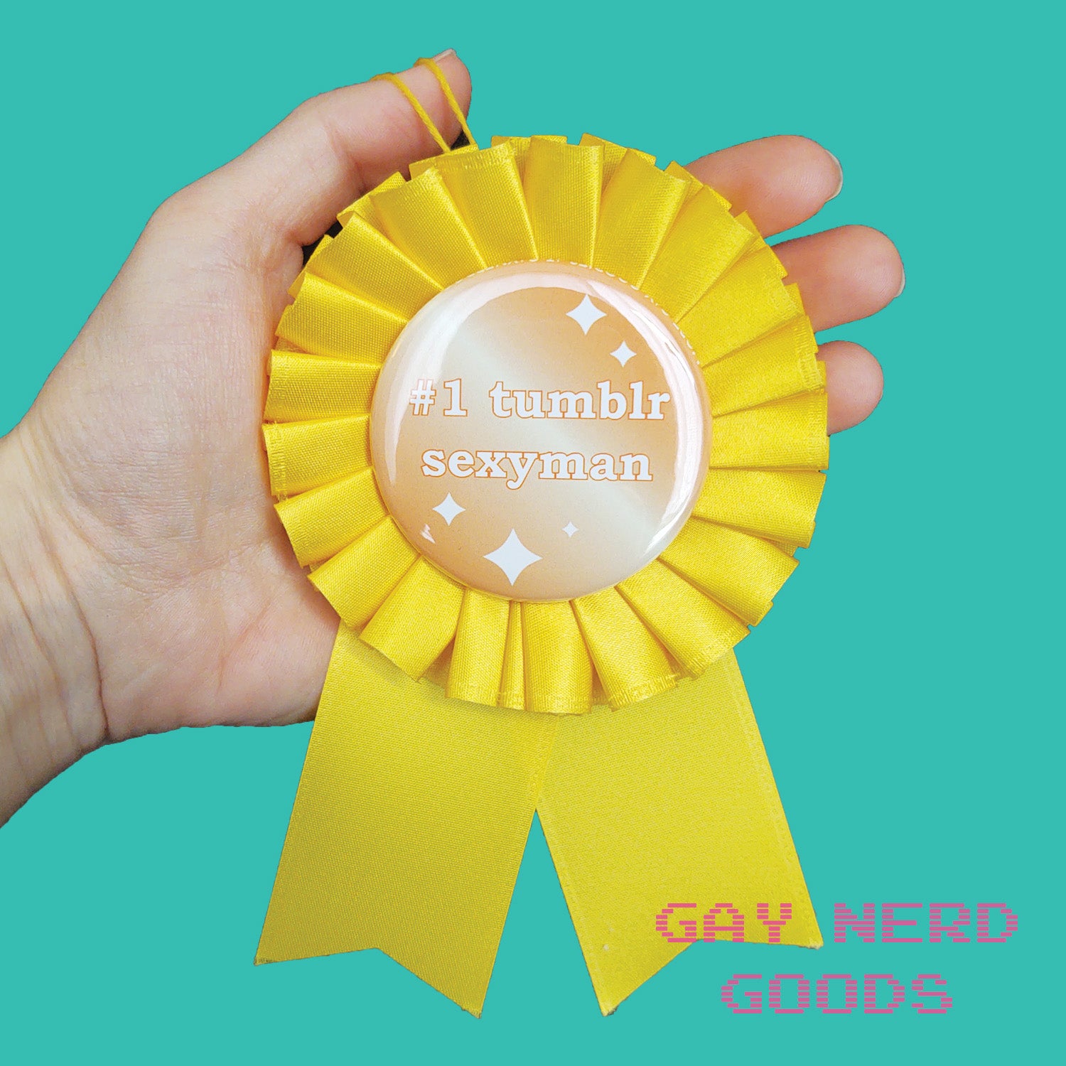 #1 tumblr sexyman award ribbon being held in a hand on a mint green background