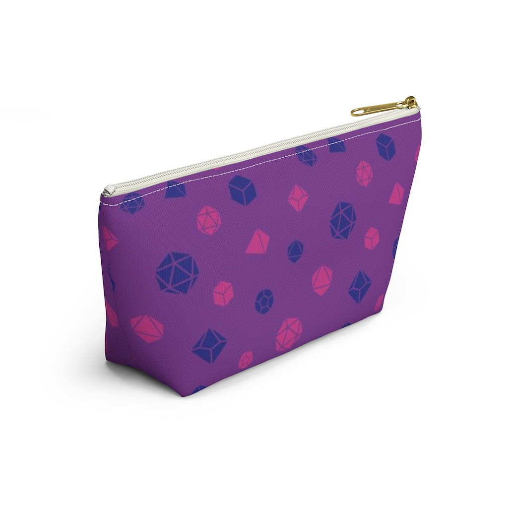 the small bisexual dice t-bottom pouch in side view on a white background. it's purple with pink and blue polyhedral dice and a gold zipper pull