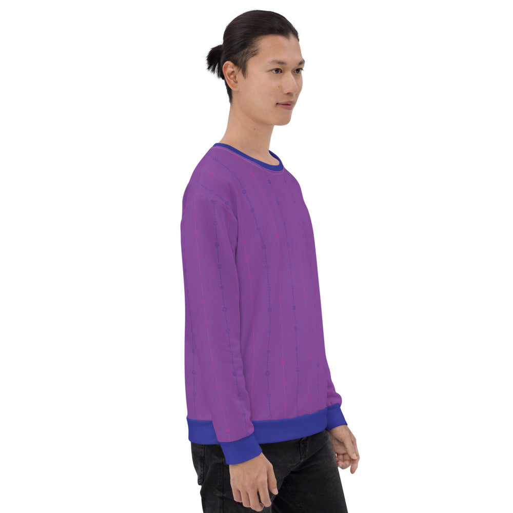 light-skinned dark haired model on a white background facing right wearing the bisexual pride dice sweater
