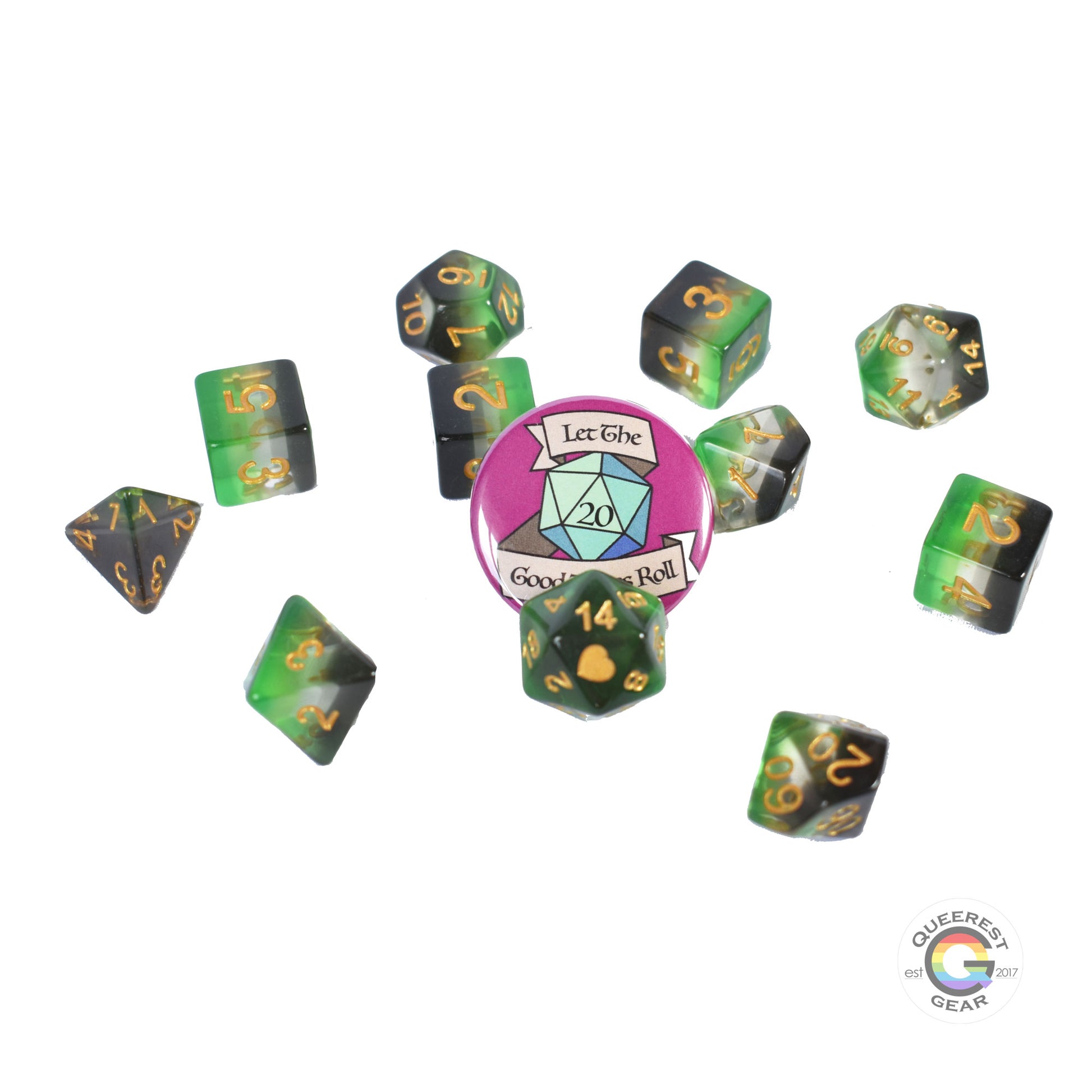 11 piece set of polyhedral dice scattered on a white background. They are transparent and colored in the stripes of the aromantic flag with gold ink. There is the freebie “let the good times roll” pinback button among them. 