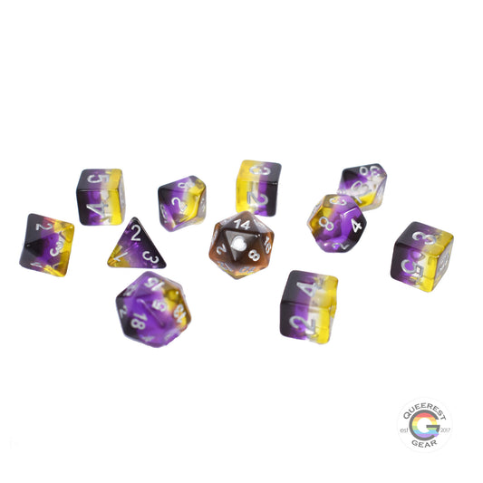 11 piece set of polyhedral dice scattered on a white background. They are transparent and colored in the stripes of the nonbinary flag with silver ink