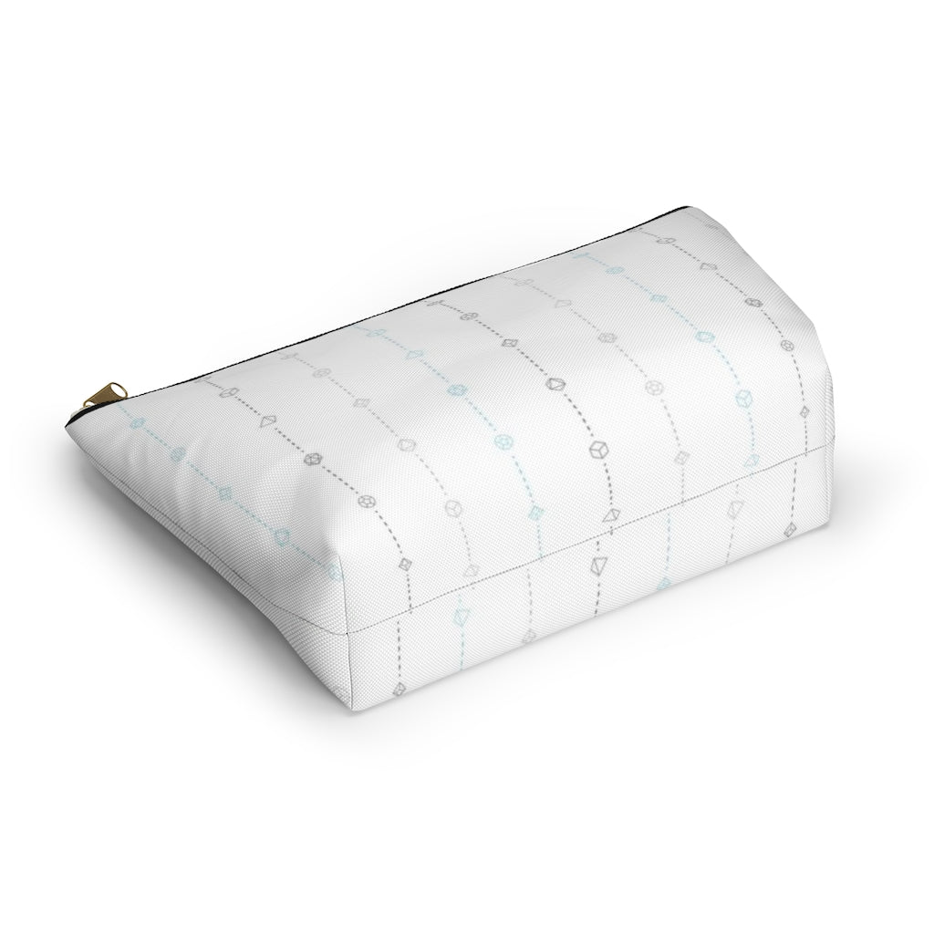 the large demiboy dice t-bottom pouch in bottom view on a white background. it's white with light grey, dark grey, and blue stripes of dashed lines and polyhedral dice and a gold zipper pull