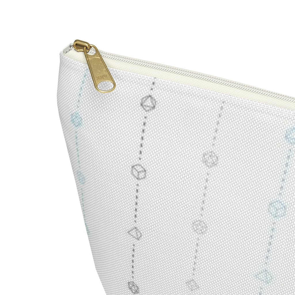 the large demiboy dice t-bottom pouch corner detail on a white background. it's white with light grey, dark grey, and blue stripes of dashed lines and polyhedral dice and a gold zipper pull