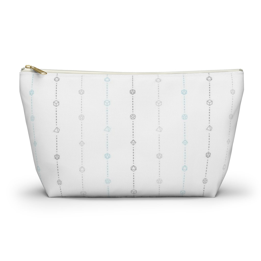 the large demiboy dice t-bottom pouch in front view on a white background. it's white with light grey, dark grey, and blue stripes of dashed lines and polyhedral dice and a gold zipper pull