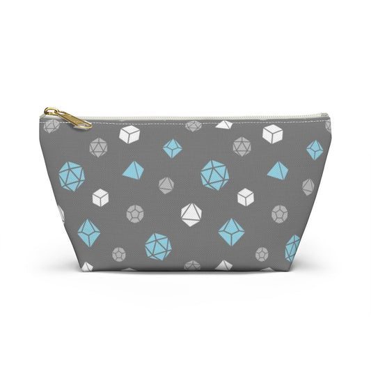 the small demiboy dice t-bottom pouch in front view on a white background. it's dark grey with light grey, white, and blue polyhedral dice and a gold zipper pull