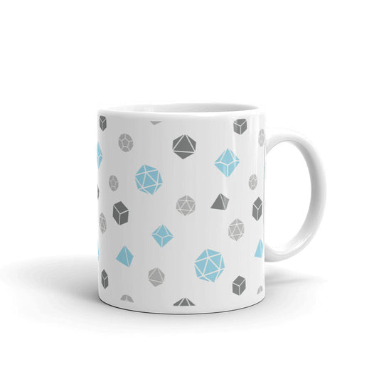 white mug on a white background with handle facing right. It has an all-over print of polyhedral d&d dice in the demiboy colors of light grey, dark grey, and blue