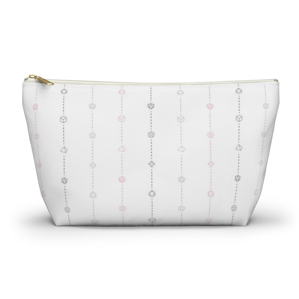 the large demigirl dice t-bottom pouch in front view on a white background. it's white with light grey, dark grey, and pink stripes of dashed lines and polyhedral dice and a gold zipper pull