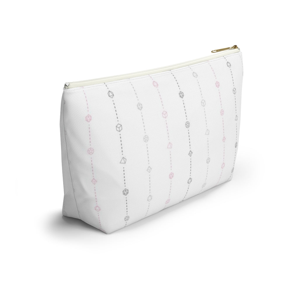 the large demigirl dice t-bottom pouch in side view on a white background. it's white with light grey, dark grey, and pink stripes of dashed lines and polyhedral dice and a gold zipper pull
