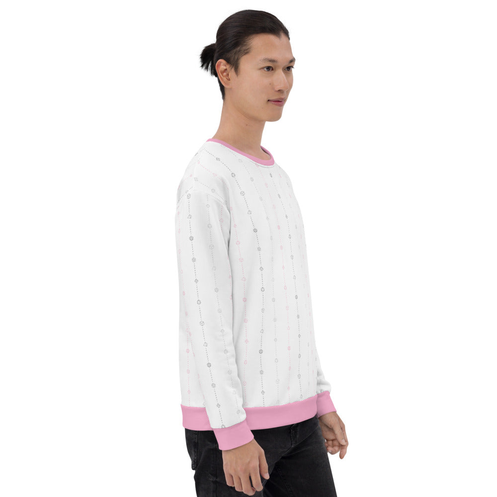 light-skinned dark haired model on a white background facing right wearing the demigirl pride dice sweater