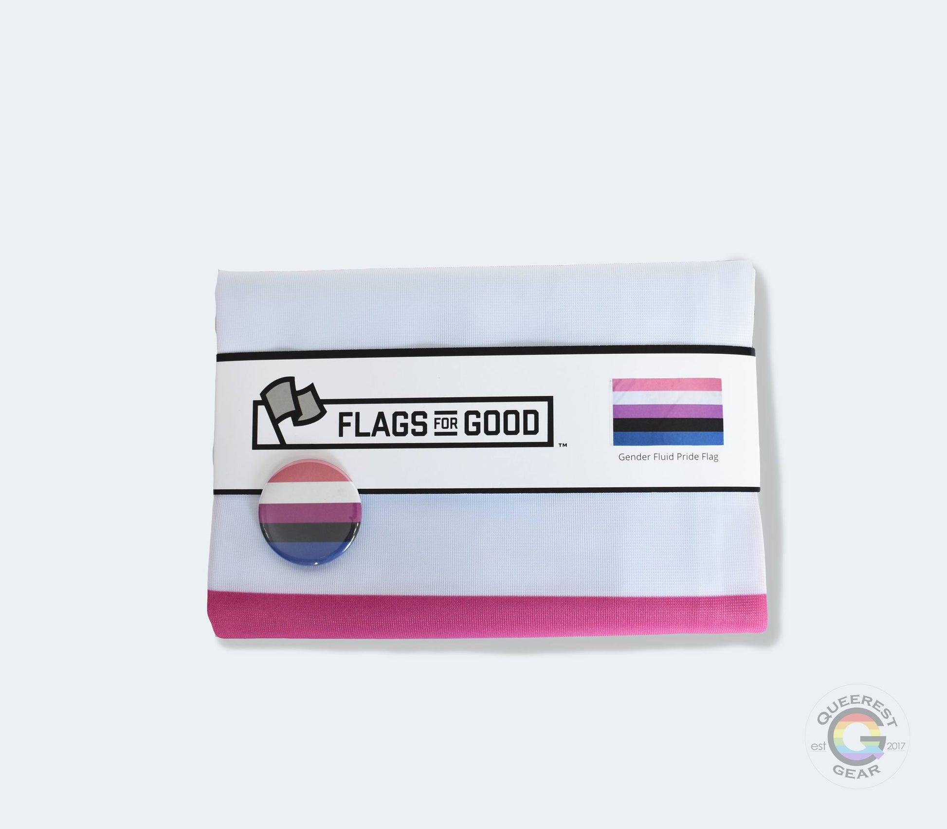 The genderfluid pride flag folded in its packaging with the matching free genderfluid flag button