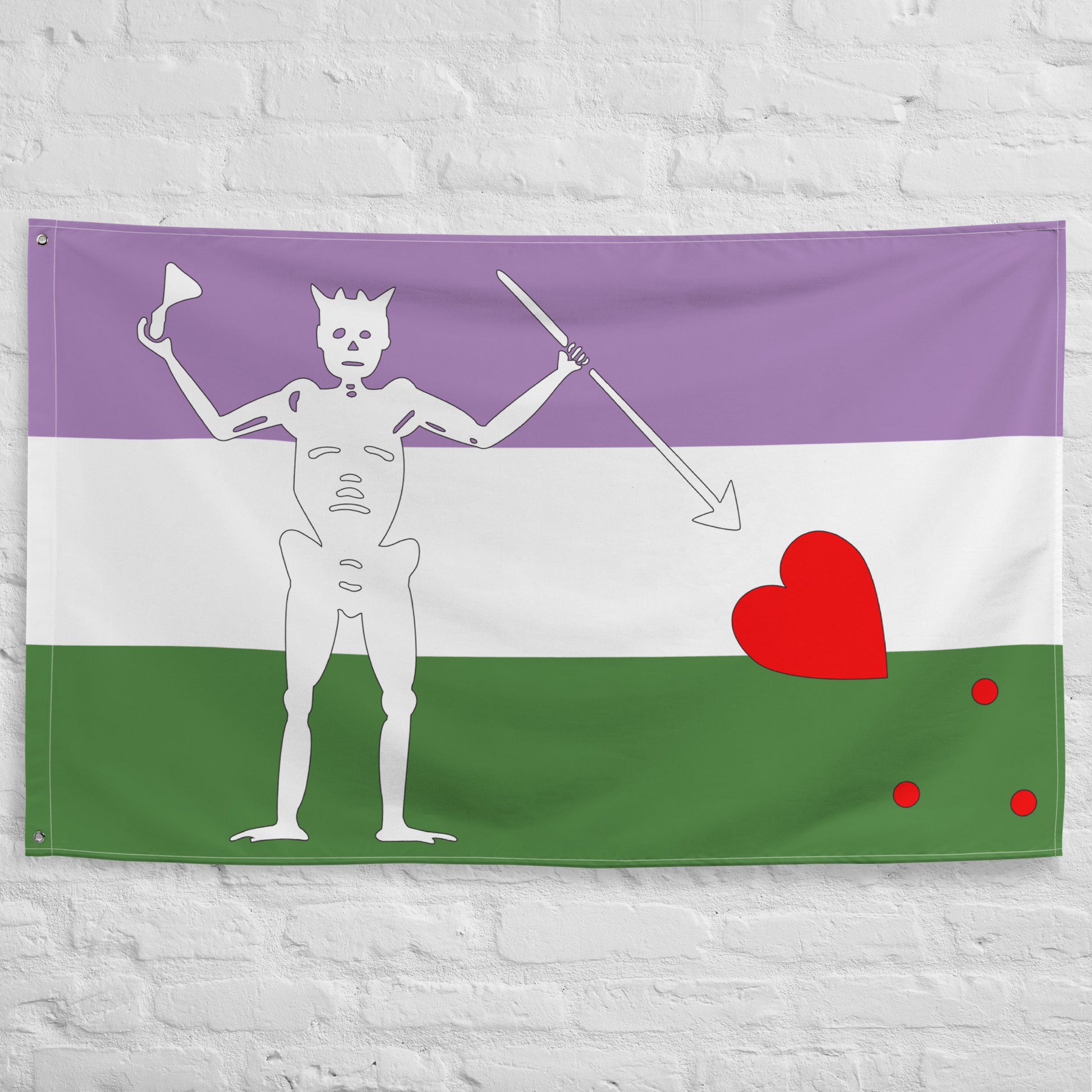 the genderqueer blackbeard pirate flag hanging on a white brick wall