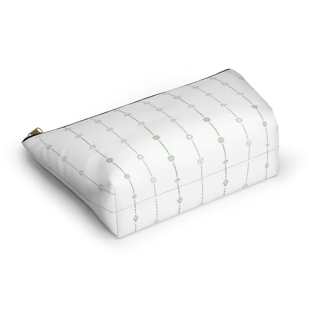 the large genderqueer dice t-bottom pouch in bottom view on a white background. it's white with green and purple stripes of dashed lines and polyhedral dice and a gold zipper pull