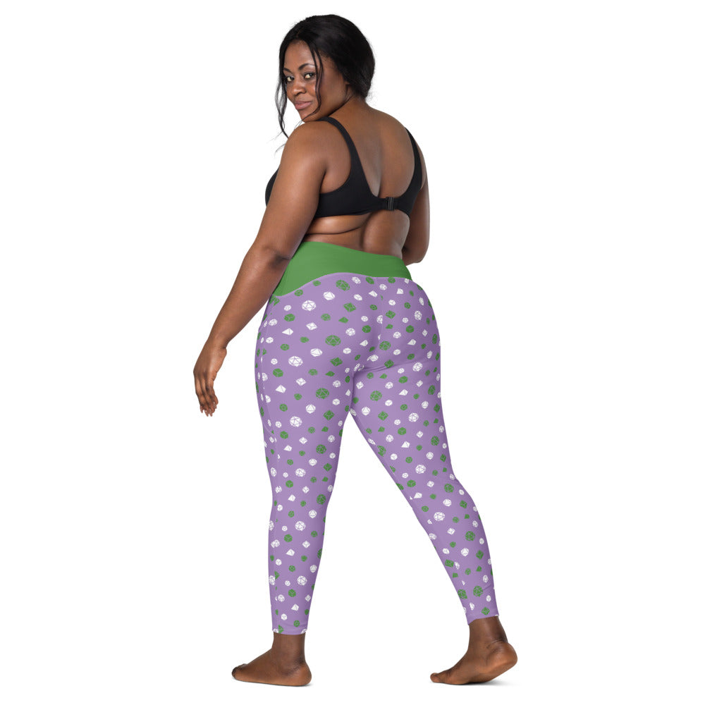 back view of dark-skinned female-presenting plus size model looking over her shoulder. She is wearing the genderqueer dice leggings and a black sports bra