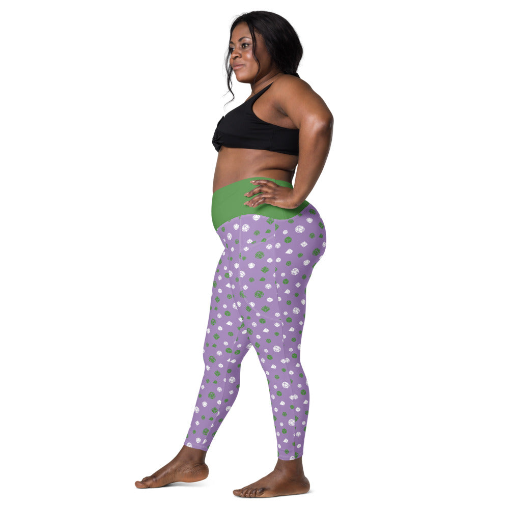Left side view of dark-skinned female-presenting model wearing the genderqueer dice leggings and black sports bra. She is facing left with her left hand on her hip and right leg forward