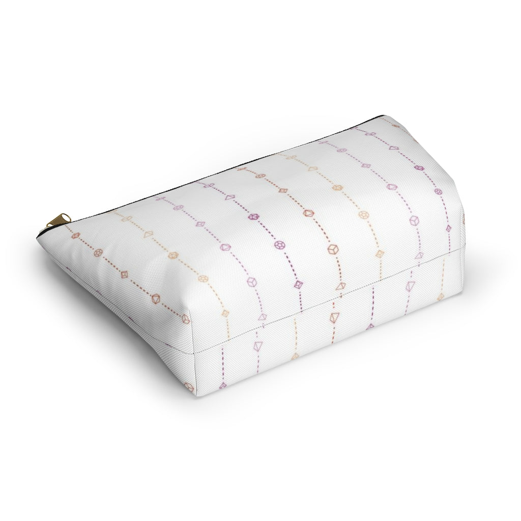 the large lesbian dice t-bottom pouch in bottom view on a white background. it's white with pink and orange stripes of dashed lines and polyhedral dice and a gold zipper pull