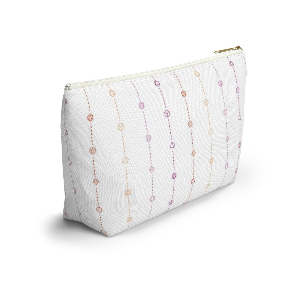 the large lesbian dice t-bottom pouch in side view on a white background. it's white with pink and orange stripes of dashed lines and polyhedral dice and a gold zipper pull