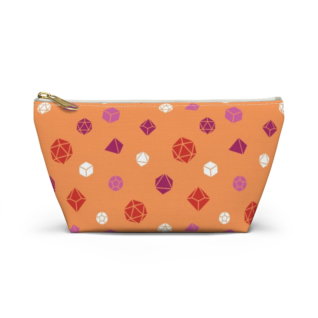 the small lesbian dice t-bottom pouch in front view on a white background. it's orange with pink, orange, and white polyhedral dice and a gold zipper pull