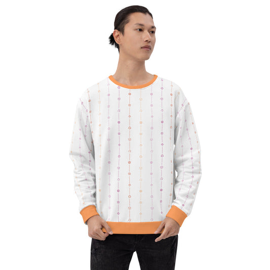 light-skinned dark haired model on a white background facing forward wearing the lesbian pride dice sweater