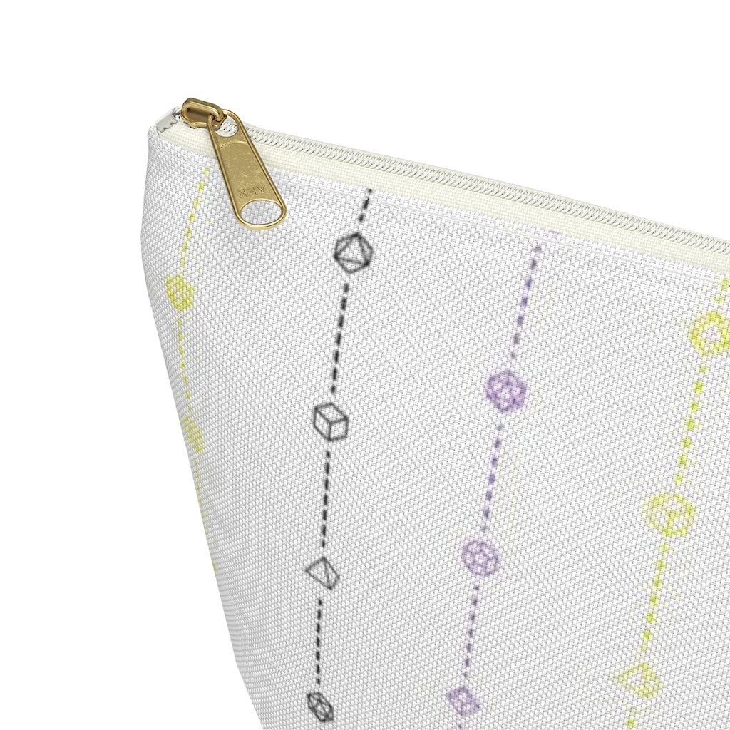 the large nonbinary dice t-bottom pouch corner detail on a white background. it's white with black, yellow, and purple stripes of dashed lines and polyhedral dice and a gold zipper pull