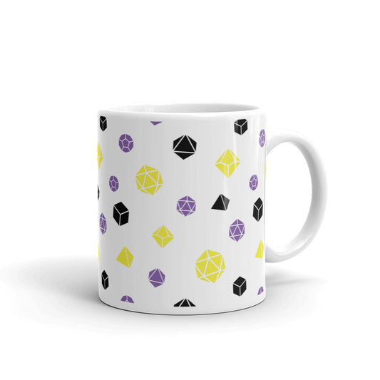 white mug on a white background with handle facing right. It has an all-over print of polyhedral d&d dice in the nonbinary colors of yellow, purple, and black