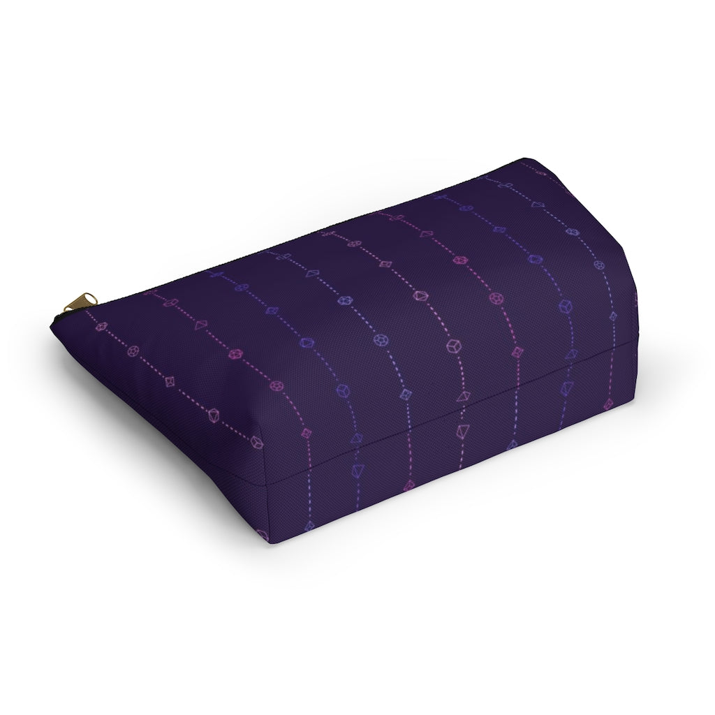 the large omnisexual dice t-bottom pouch in bottom view on a white background. it's dark purple with pink and blue stripes of dashed lines and polyhedral dice and a gold zipper pull