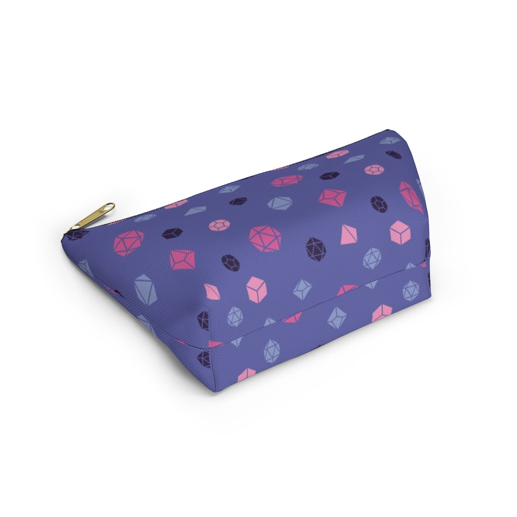 the small omnisexual dice t-bottom pouch in bottom view on a white background. it's blue with pink, blue, and dark purple polyhedral dice and a gold zipper pull
