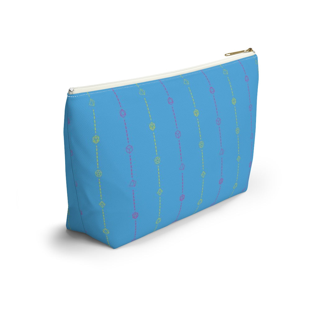 the large pansexual dice t-bottom pouch in side view on a white background. it's blue with pink and yellow stripes of dashed lines and polyhedral dice and a gold zipper pull