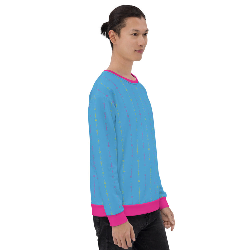 light-skinned dark haired model on a white background facing right wearing the pansexual pride dice sweater