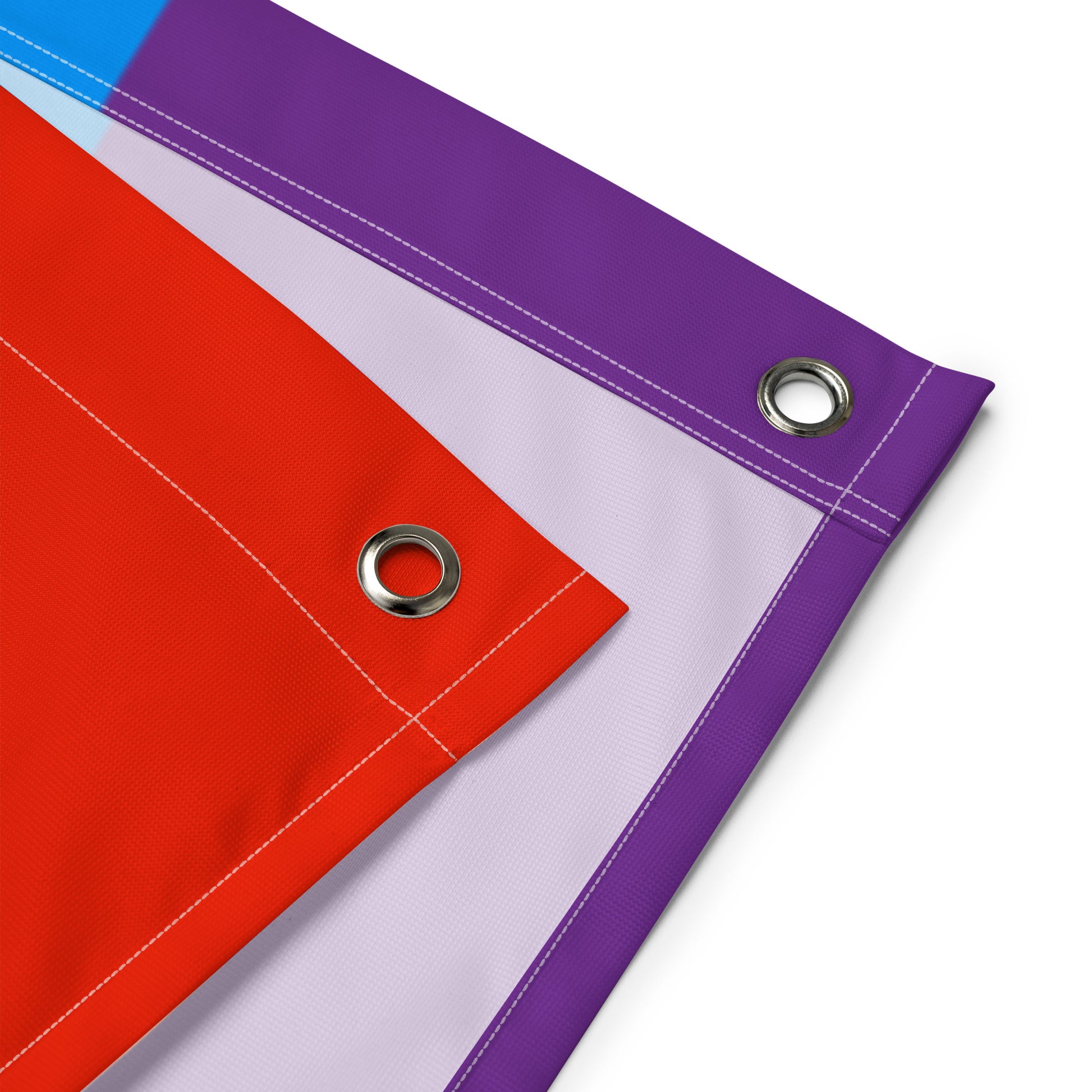 a close-up of the grommets at the corners of the rainbow blackbeard pride flag