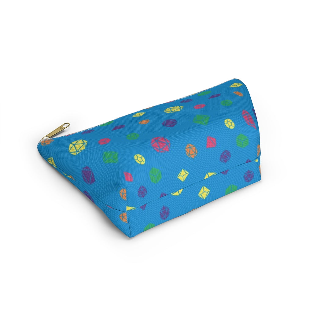 the small rainbow dice t-bottom pouch in bottom view on a white background. it's blue with pink, orange, yellow, green, and purple polyhedral dice and a gold zipper pull