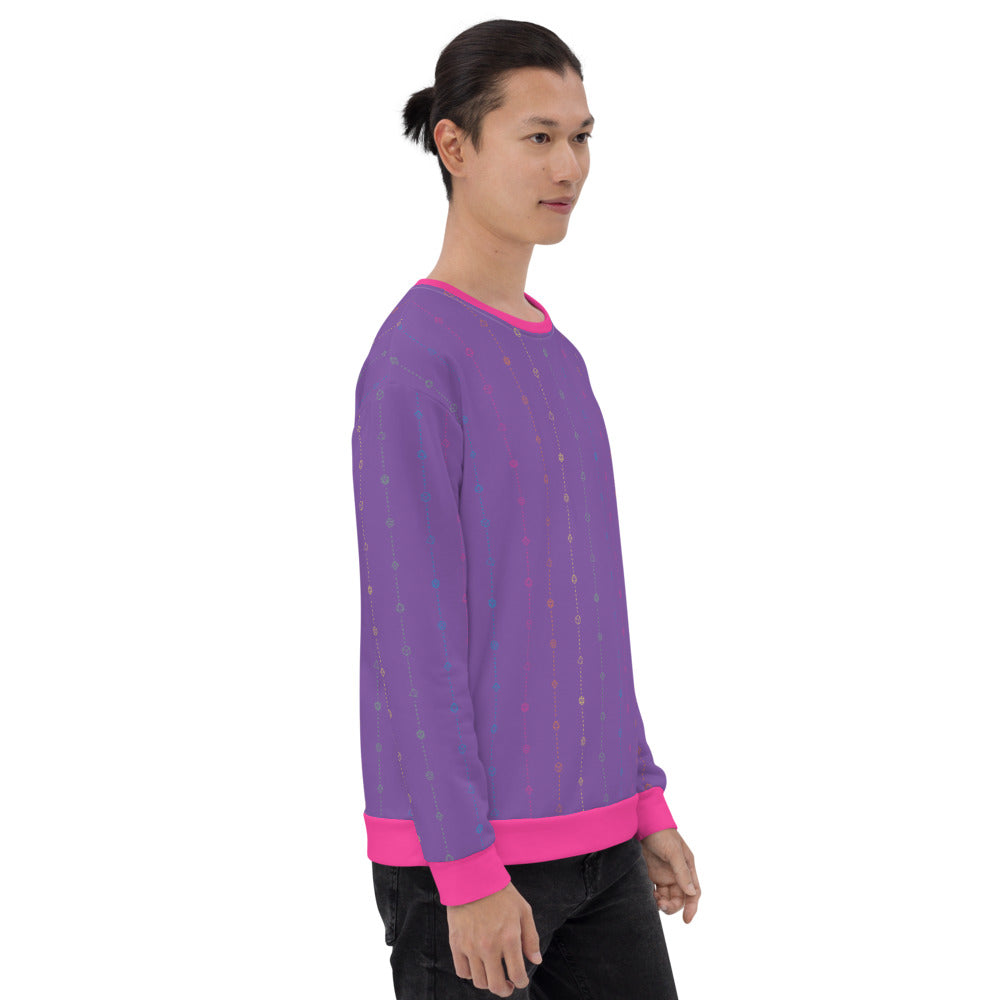 light-skinned dark haired model on a white background facing right wearing the rainbow pride dice sweater