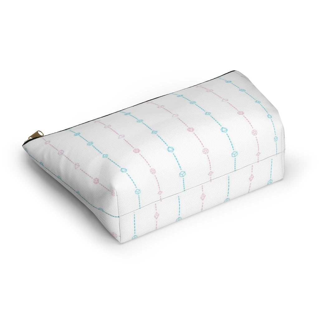 the small trans dice t-bottom pouch from the bottom on a white background. it's white with pink and blue stripes of dashed lines and polyhedral dice and a gold zipper pull